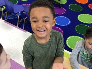 Excited Young Man Holding a Seed to Plant